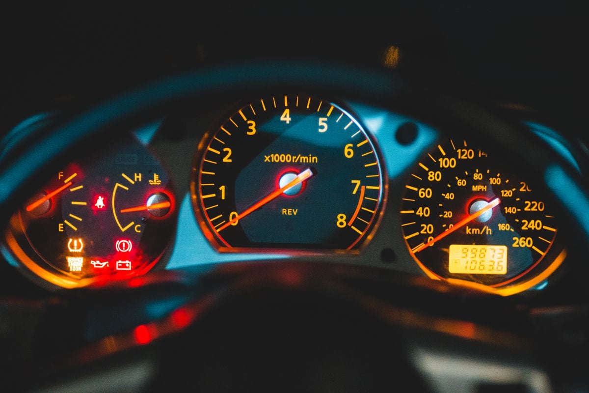 Illuminated instrument cluster showing gauges and dashboard warning lights at key-on