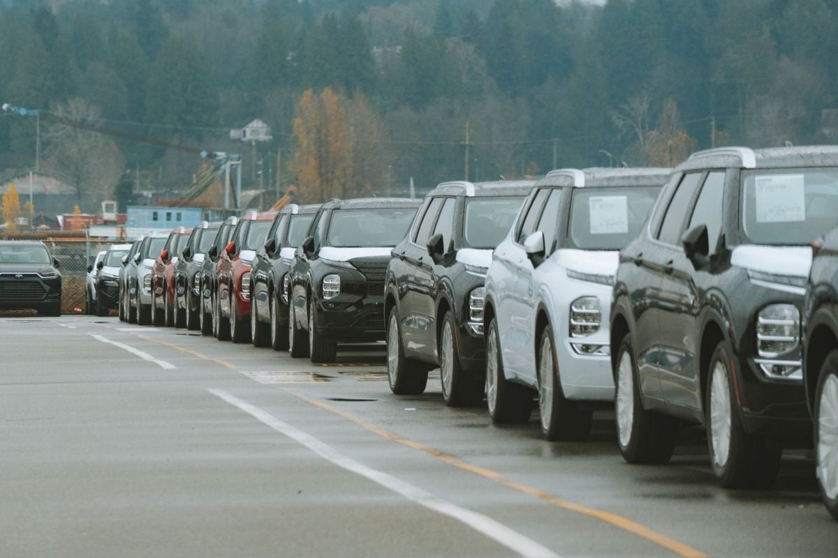 Rows of used cars and SUVs parked on a dealership lot